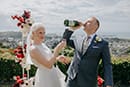 bride and groom happily drinking champagne to celebrate as newly weds- Nelson Wedding