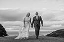 bride and groom walking happily in the wonders of Nelson- Nelson Wedding